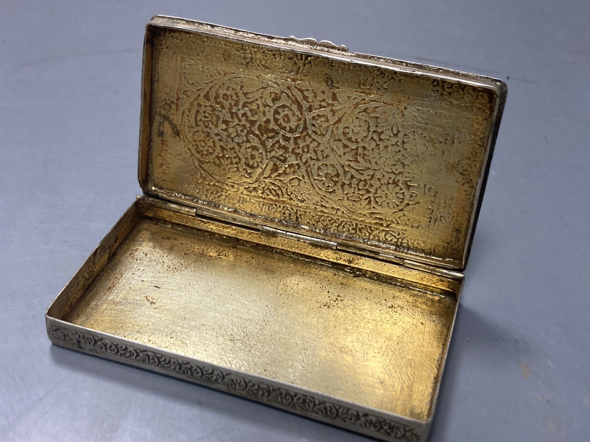 Two Chinese white metal filigree card cases, one with enamel(a.f.) & an Indian white metal snuff box, largest 91mm.